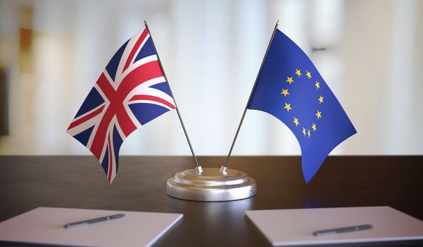 Great Britain and EU flags on table. Brexit negotiation between  - Zdjęcie, obraz