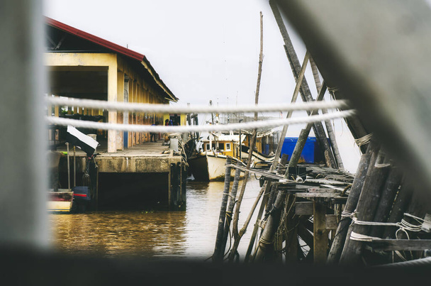 Beautiful rural scenery, wooden jetty or traditional fisherman dock over cloudy sky background - Photo, image