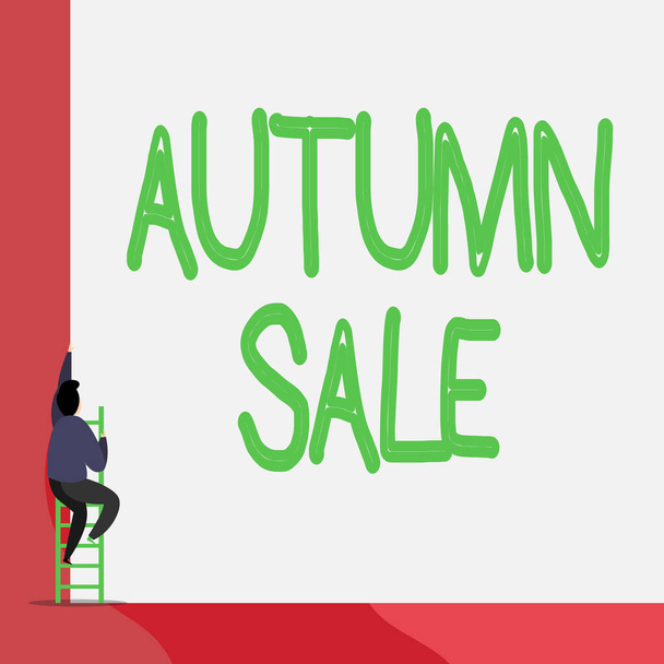 Text sign showing Autumn Sale. Conceptual photo having great discounts products on season after summer Back view young man climbing up staircase ladder lying big blank rectangle. - Photo, Image
