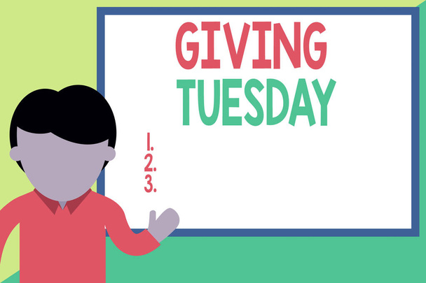 Conceptual hand writing showing Giving Tuesday. Business photo showcasing international day of charitable giving Hashtag activism Man standing front whiteboard pointing to project photo Art. - Photo, Image