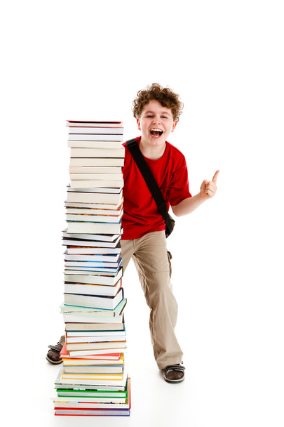 Student standing close to pile of books on white background - Фото, изображение