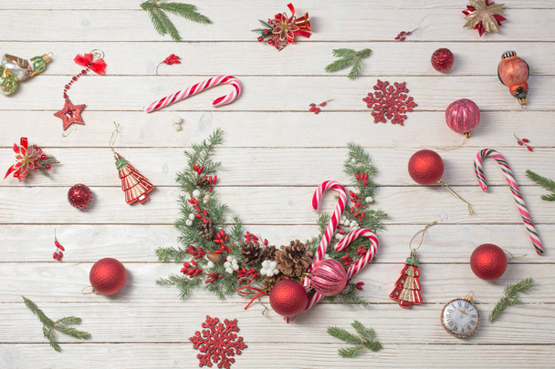 Christmas wreath on white wooden backdrop - Fotó, kép