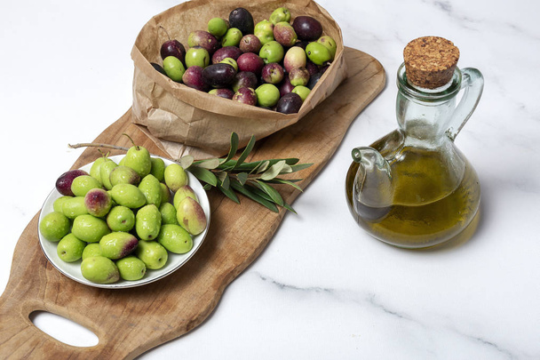 Fresh Spanish extra virgin olive oil with olives - Фото, изображение