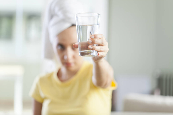 Young woman with a glass of water - Foto, immagini