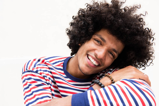 Close up portrait of smiling young North African man relaxing - Photo, Image