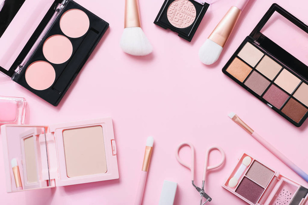 Flat lay composition with products for decorative makeup on past - 写真・画像