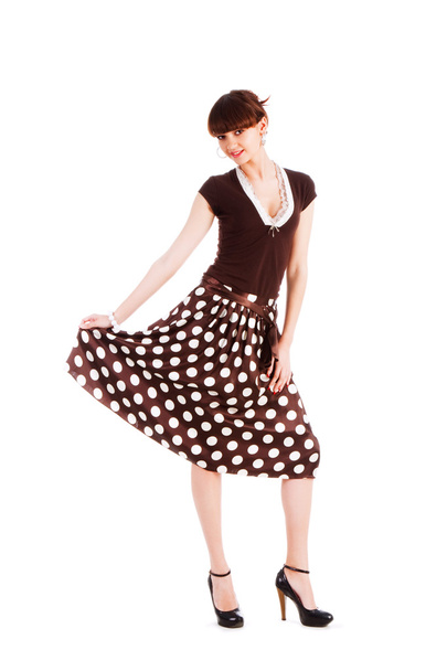 Young beautiful girl in spotted skirt - Photo, Image