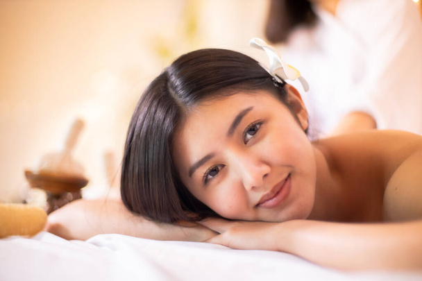 Asian Beautiful, young and healthy woman in spa salon. Massage t - Fotografie, Obrázek