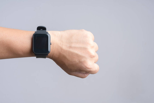 Hand wearing modern smart watch - Photo, Image