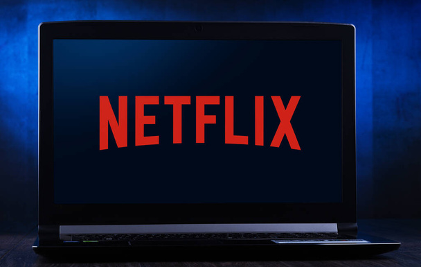 Laptop computer displaying logo of Netflix - Photo, image