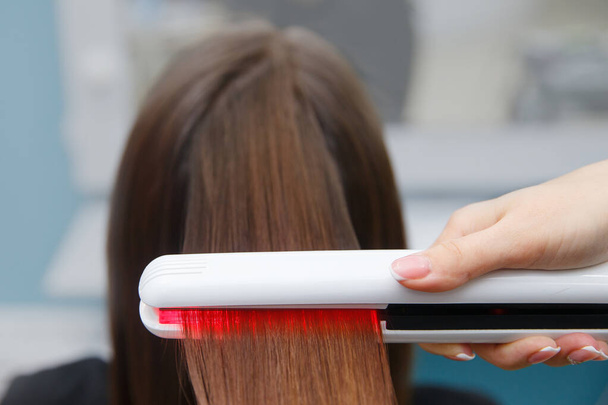 keratin recovery hair and protein treatment pile with professional ultrasonic iron tool. - Photo, Image
