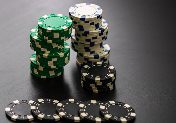 Stack of poker chips on black background. - Photo, Image
