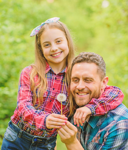 spring village country. little girl and happy man dad. earth day. ecology. Happy family day. family summer farm. daughter and father with dandelion. Green flower. Care of soil - Photo, Image