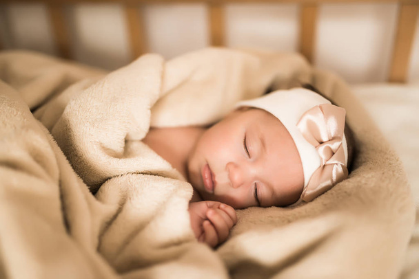 Newborn baby sleeping sweetly in the crib - Foto, Imagem