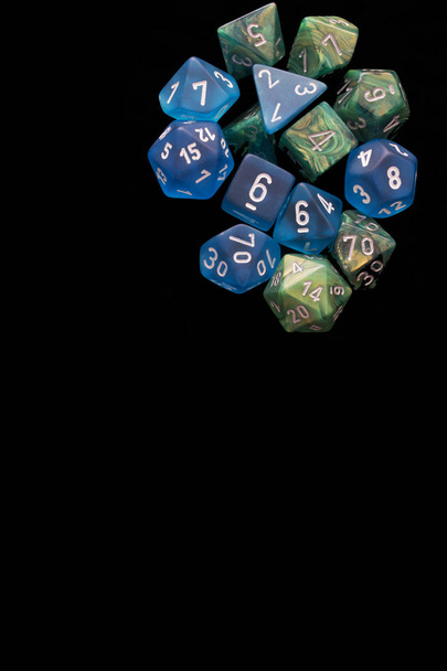 2 RPG sets blue/green for playing role playing games on black background. - Photo, Image