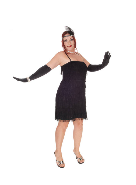 Жінка стоїть в чорній сукні і довгі гвоздики
 - Фото, зображення