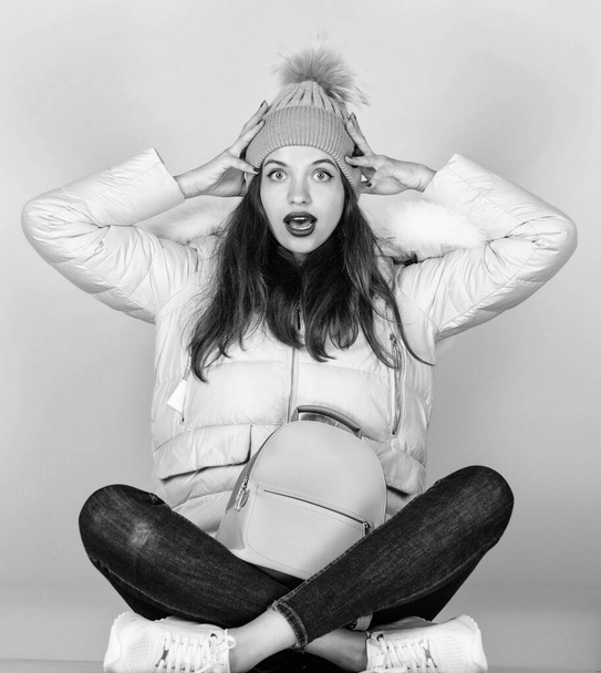 in shock. girl in puffed coat. faux fur fashion. flu and cold season. Leather bag fashion. woman in beanie hat with backpack. happy winter holidays. warm winter clothing. shopping - Valokuva, kuva