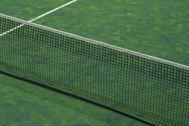 Tennis court indoor with green carpet surface - Fotografie, Obrázek