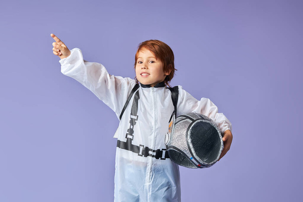 Portrait of cute little boy wearing cosmonaut suit - Фото, изображение