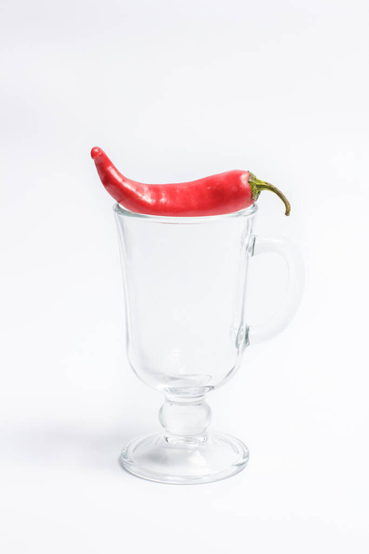 Hot peppers for spicy dishes on a white background - Foto, imagen