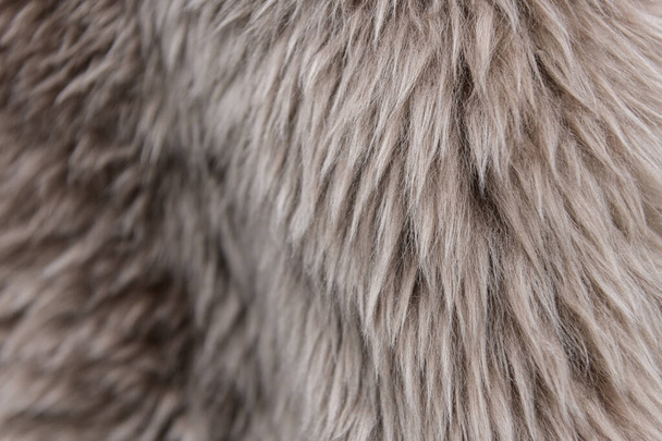 The texture of beige fur. The fur is beautiful, long hair. Shades of gray - dark and light. - Photo, Image