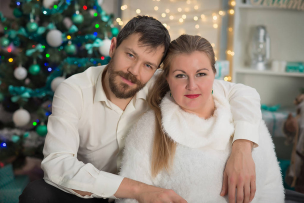 Young family portrait  in Christmas interior with New Year eve a - Fotografie, Obrázek