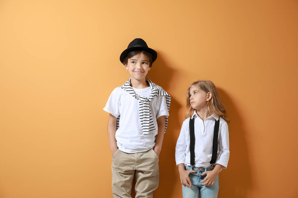 Stylish little children on color background - Photo, Image