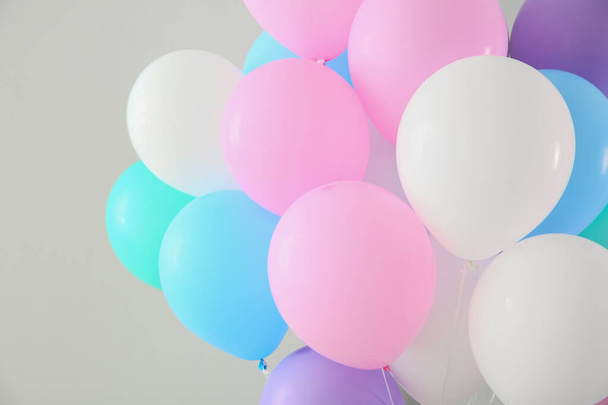Air balloons on light background - Фото, зображення