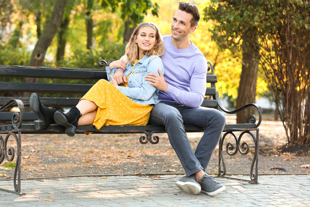 Happy young couple on romantic date in park - Photo, Image