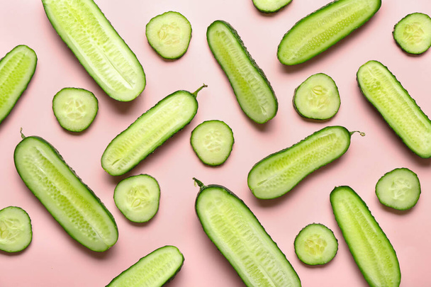 Pieces of fresh cucumbers on color background - Photo, Image