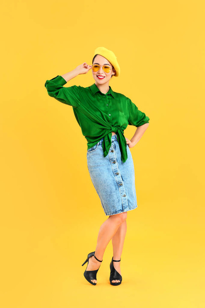 Fashionable Asian woman on color background - 写真・画像