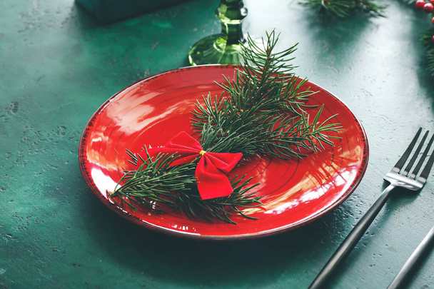 Beautiful table setting for Christmas dinner on color background - Foto, Bild