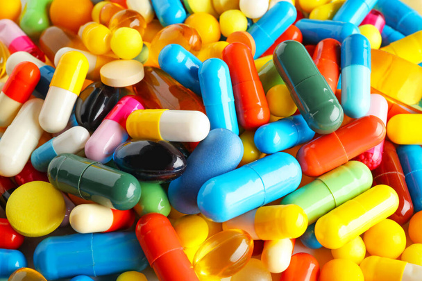 Heap of different pills, closeup - Фото, изображение