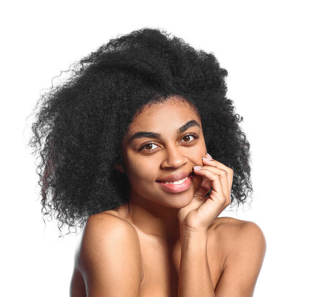 Portrait of beautiful African-American woman on white background - Fotografie, Obrázek