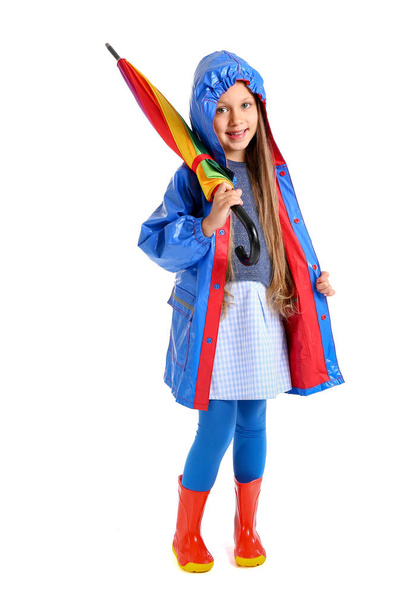Модна маленька дівчинка в осінньому одязі і з парасолькою на білому тлі
 - Фото, зображення
