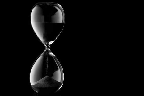 Crystal hourglass on dark background - Photo, Image