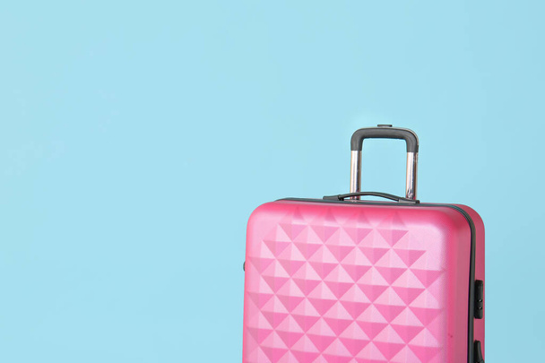 Packed suitcase on color background. Travel concept - Foto, imagen