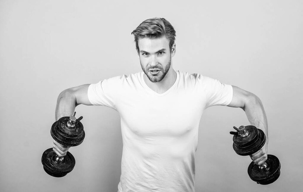 be strong. Athletic fitness man. Weight lifting. man workout with barbell. power and energy. Strong muscles and power. man lifting barbell. sportsman training in gym. Sport dumbbell equipment - Fotografie, Obrázek