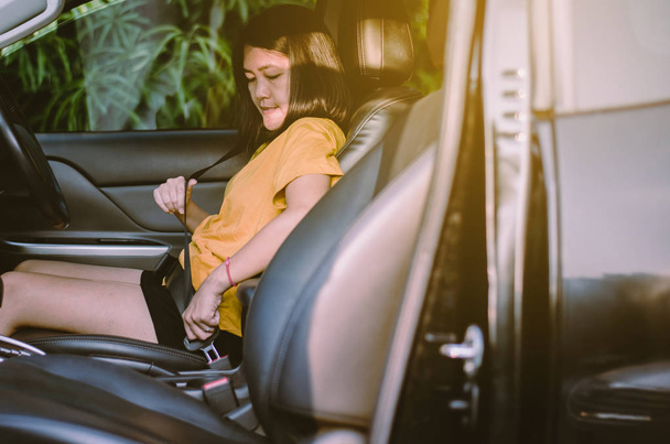 Asian woman driving hands fastening or putting seat belt in modern car,Buckle up - Φωτογραφία, εικόνα