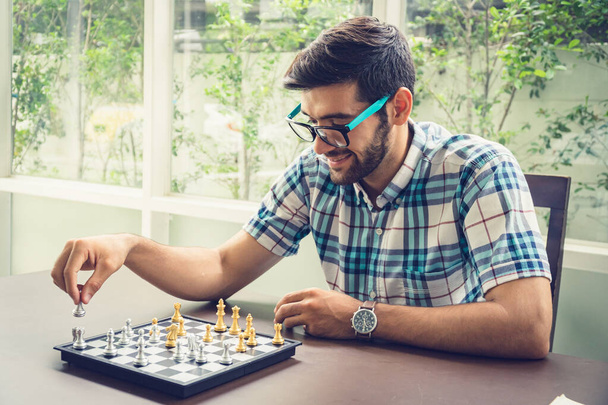 Casual businessman playing chess game with retro style photo, in - Фото, зображення