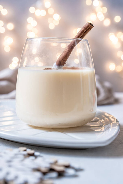 Traditional Christmas drink eggnog with cinnamon - Photo, image