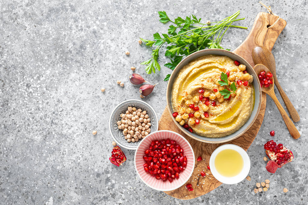 Chickpea hummus with tahini in a bowl. Healthy vegetarian appetizer. Middle Eastern cuisine - Fotografie, Obrázek