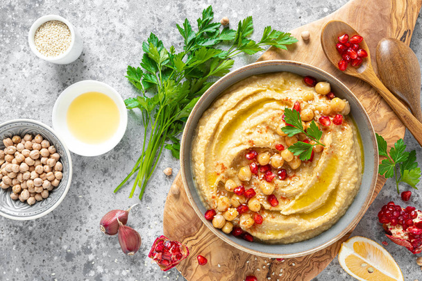 Chickpea hummus with tahini in a bowl. Healthy vegetarian appetizer. Middle Eastern cuisine - 写真・画像