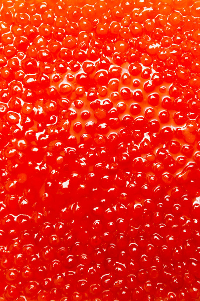 Red salmon caviar close-up, a lot of small eggs - Photo, Image