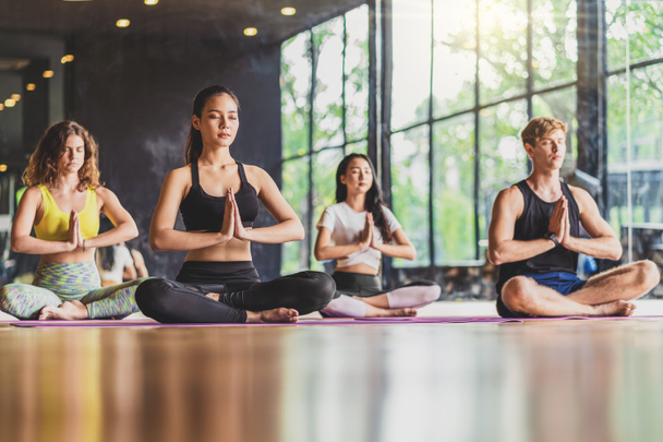 "Group of diversity practicing yoga class, healthy or Meditation Exercise,stretching in upward facing dog exercise, wearing sportswear bra and pants, sports and healthcare concept - Photo, Image