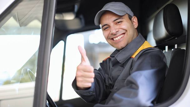 Smiling van driver portrait giving thumbs up - Φωτογραφία, εικόνα