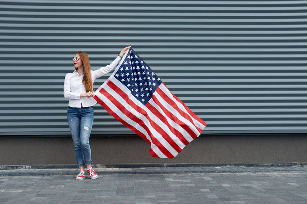 Independence day and patriotic concept. Young redhead woman with - Photo, Image
