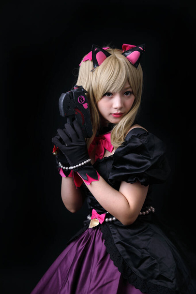 Japan anime cosplay , portrait of girl cosplay isolated in black - Photo, Image