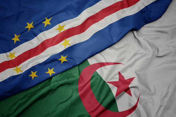 хвилястий барвистий прапор Алжиру та національний прапор мису Верде
. - Фото, зображення