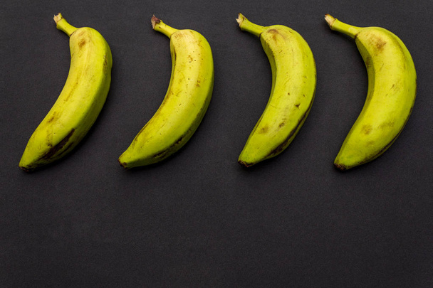 Bananas on different background - Foto, Imagen